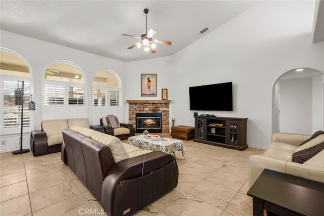 living room featuring high vaulted ceiling and ceiling fan