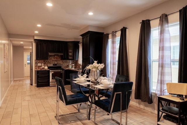 dining area with light wood-type flooring