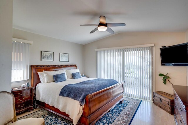 bedroom featuring ceiling fan, lofted ceiling, access to exterior, and light wood-type flooring