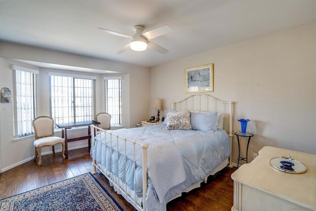 bedroom featuring dark hardwood / wood-style floors and ceiling fan