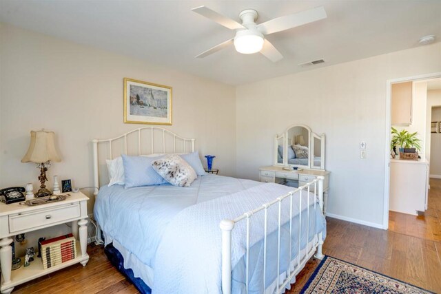 bedroom with hardwood / wood-style floors and ceiling fan