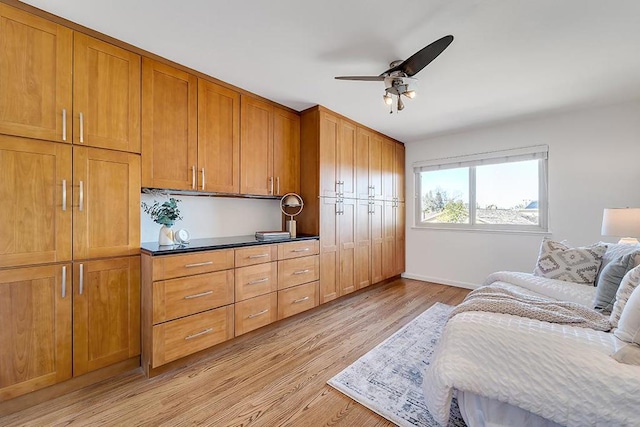 bedroom featuring ceiling fan and light hardwood / wood-style floors