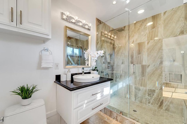 bathroom with an enclosed shower, vanity, and toilet