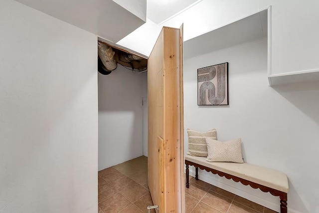 corridor featuring light tile patterned flooring