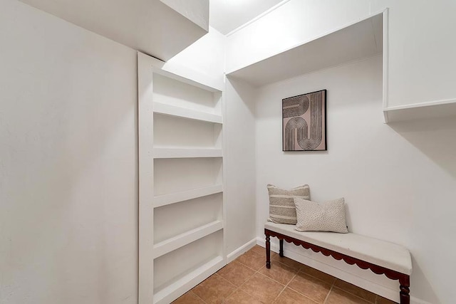 walk in closet featuring light tile patterned floors