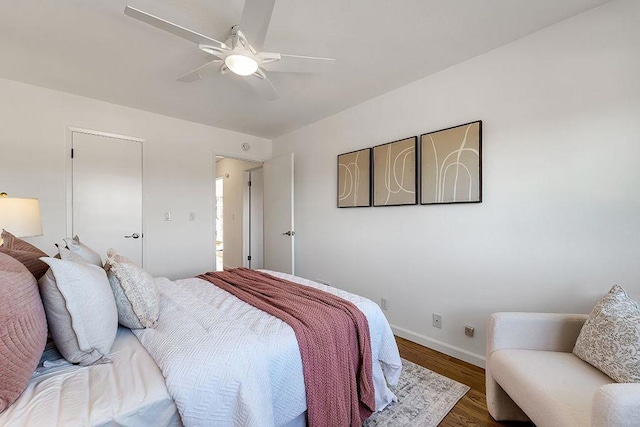 bedroom with hardwood / wood-style flooring and ceiling fan