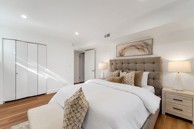 bedroom featuring light hardwood / wood-style flooring and a closet