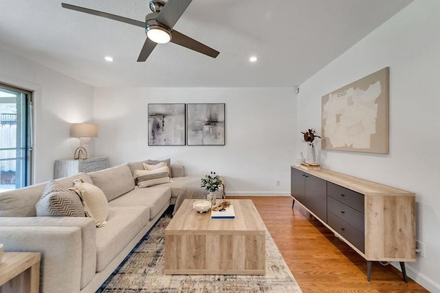 living room with ceiling fan and light hardwood / wood-style floors