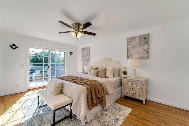 bedroom featuring ceiling fan, wood-type flooring, and access to outside