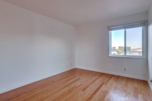 unfurnished room featuring light wood-type flooring