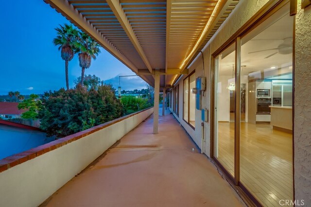 view of balcony at dusk