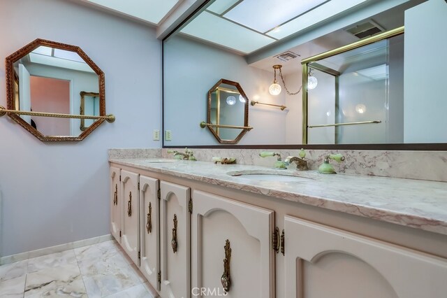 bathroom featuring vanity and a skylight