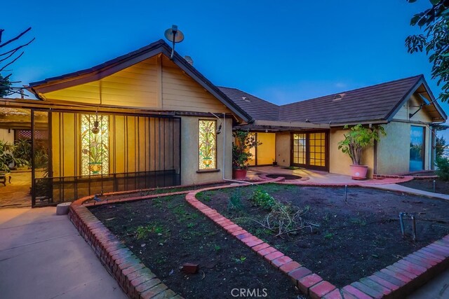 rear view of house featuring a patio area