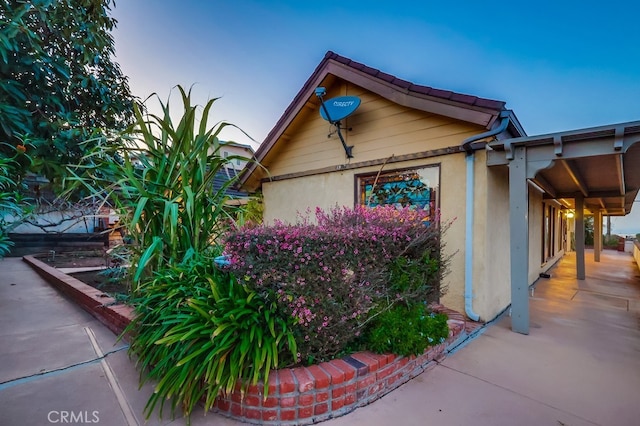 view of home's exterior with a patio