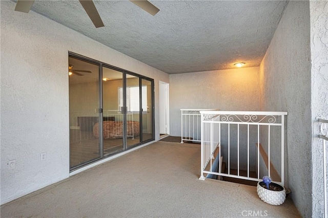 interior space with carpet and a textured ceiling