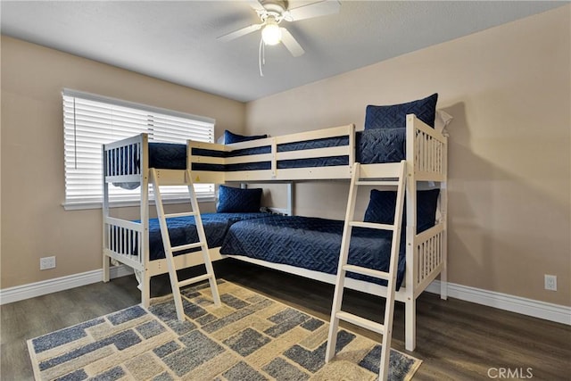 bedroom with dark wood-type flooring