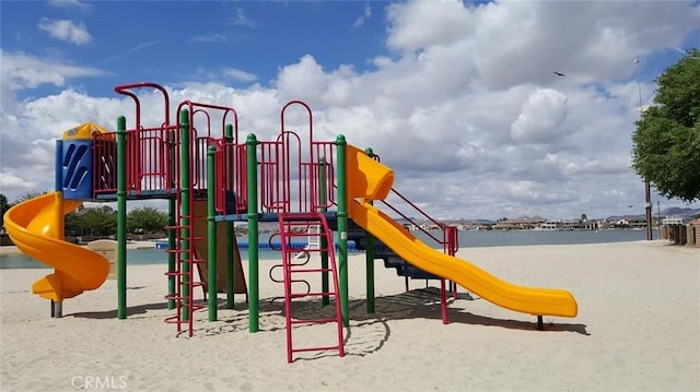 view of jungle gym with a water view