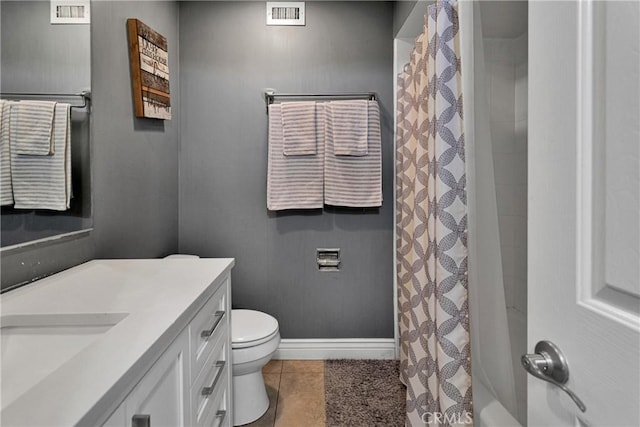 bathroom with vanity, a shower with shower curtain, tile patterned floors, and toilet