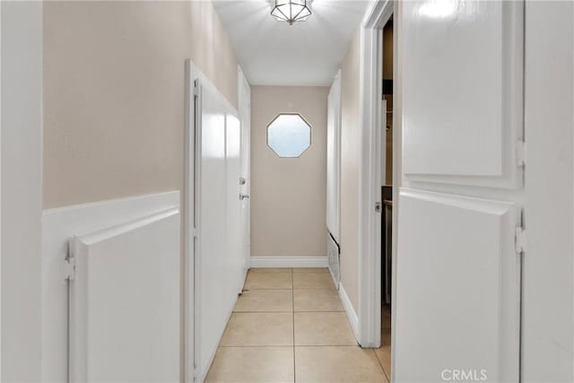 entryway with light tile patterned floors