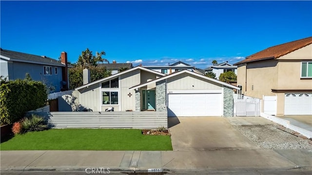 view of front of house with a garage and a front lawn