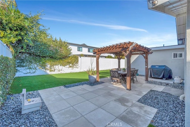 view of patio with a grill and a pergola