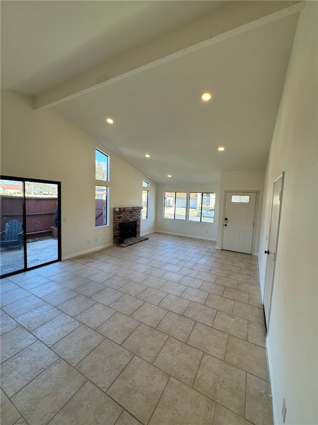 unfurnished living room with a brick fireplace, high vaulted ceiling, and beam ceiling