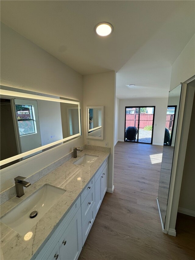 bathroom featuring vanity and hardwood / wood-style floors