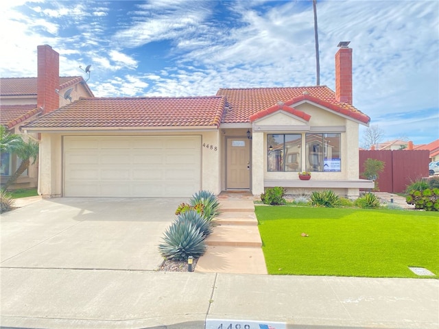 view of front of house featuring a garage and a front yard