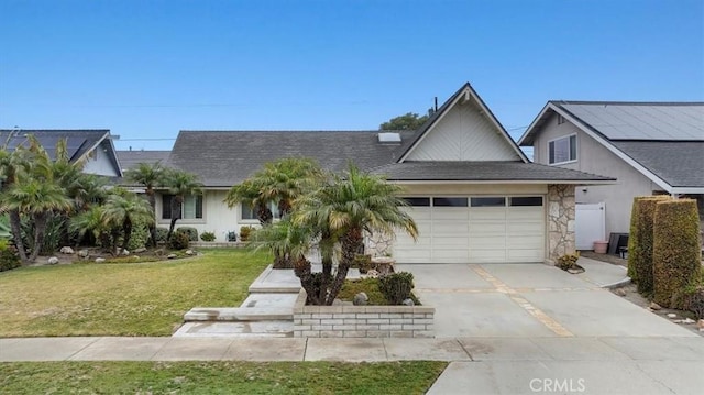 view of front of house featuring a garage and a front yard