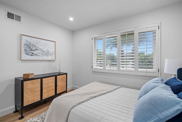 bedroom featuring hardwood / wood-style flooring