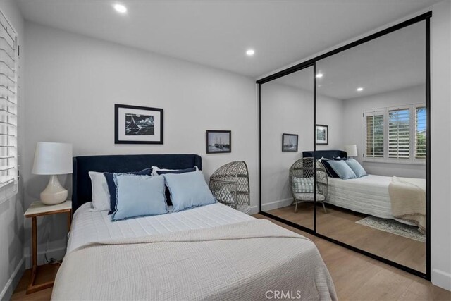 bedroom with light hardwood / wood-style floors