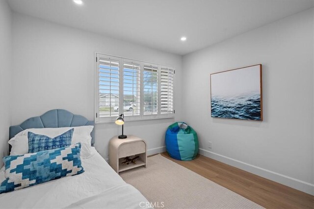 bedroom featuring hardwood / wood-style flooring