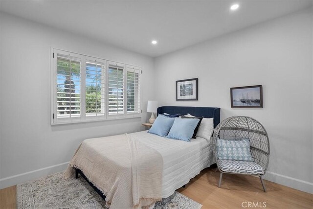 bedroom featuring hardwood / wood-style floors