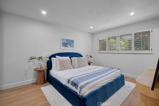 bedroom with light hardwood / wood-style flooring