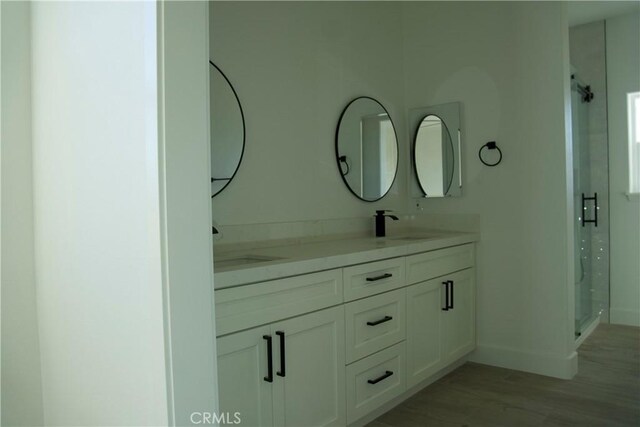 bathroom featuring vanity and hardwood / wood-style flooring