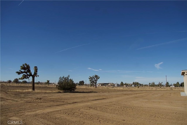 view of yard with a rural view