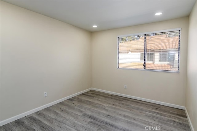 unfurnished room with light hardwood / wood-style floors