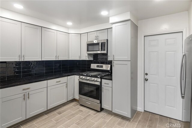 kitchen featuring decorative backsplash and stainless steel appliances