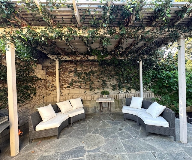 view of patio with a pergola and outdoor lounge area