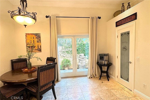 entryway featuring french doors and crown molding