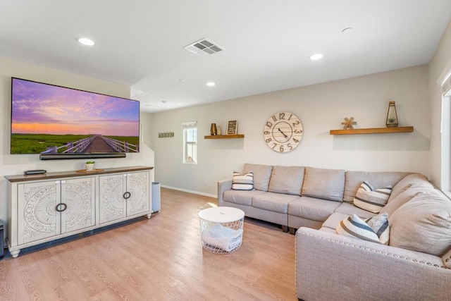 living room with light hardwood / wood-style flooring