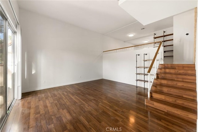 unfurnished room with dark hardwood / wood-style floors