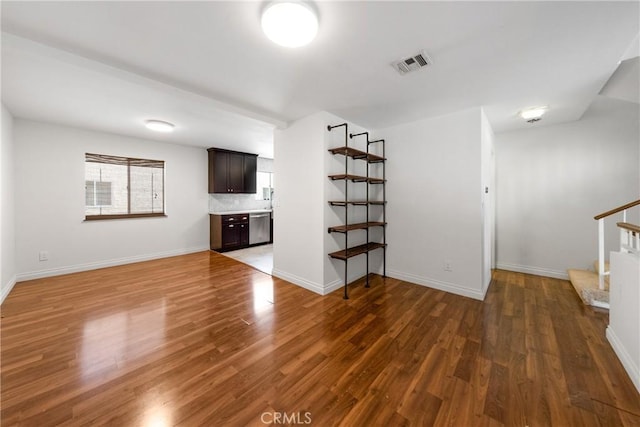 unfurnished living room featuring dark hardwood / wood-style flooring