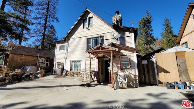 rear view of property with a patio