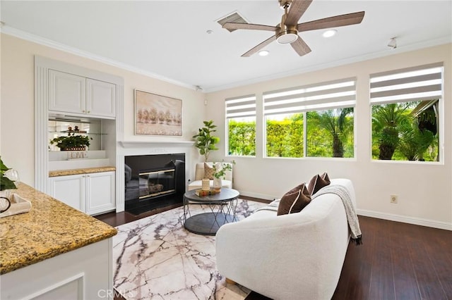 living room featuring ceiling fan, ornamental molding, and dark hardwood / wood-style flooring