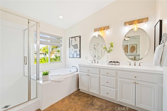 bathroom featuring vanity and shower with separate bathtub