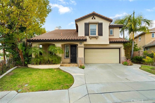 mediterranean / spanish home featuring a garage and a front lawn