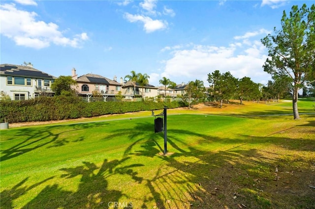 view of property's community featuring a yard