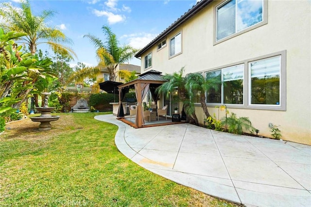 view of yard featuring a gazebo and a patio