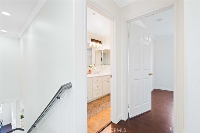 hall featuring crown molding and dark hardwood / wood-style flooring